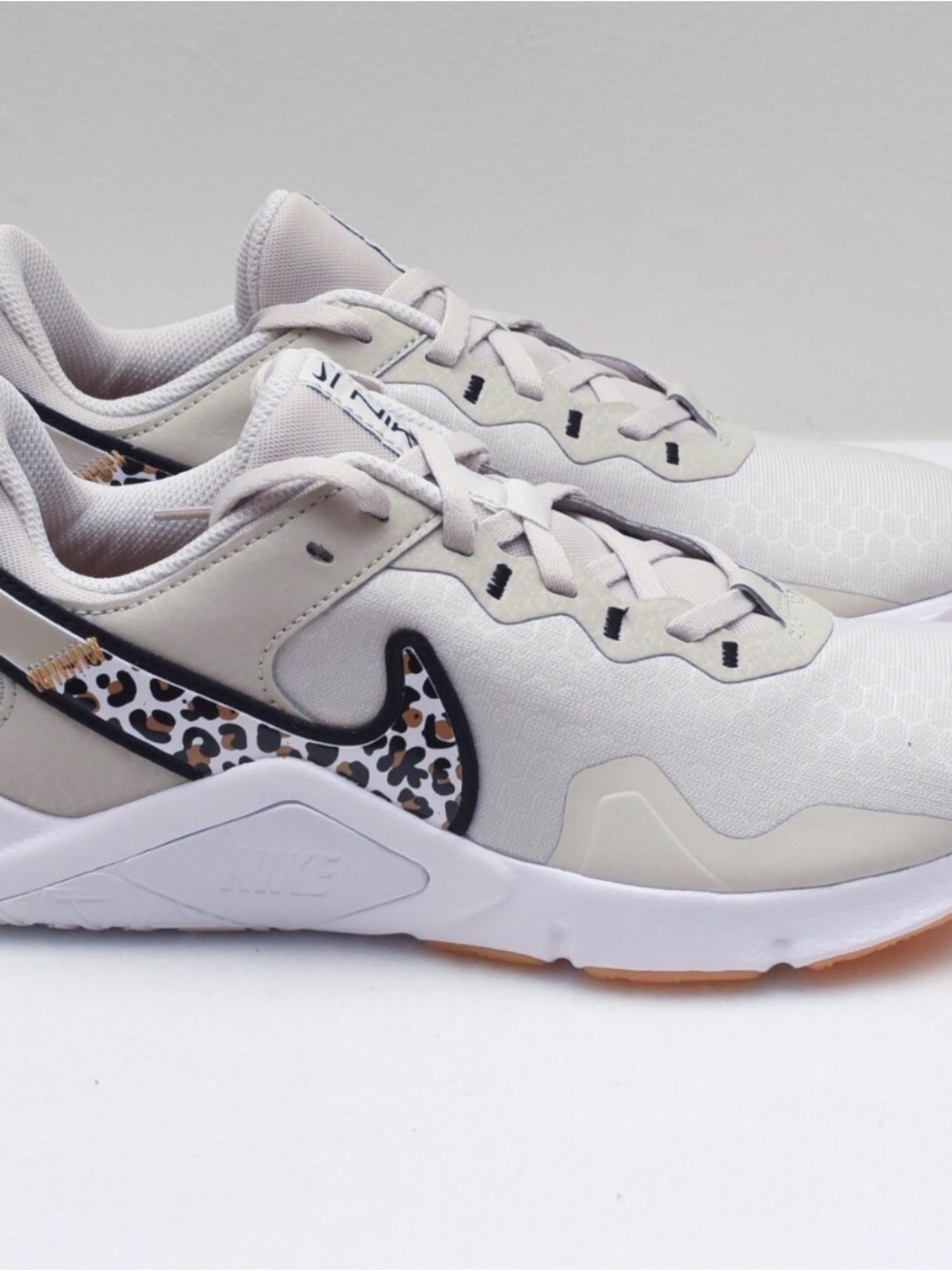 Nike Women’s Light Gray Sneakers with Leopard Swoosh